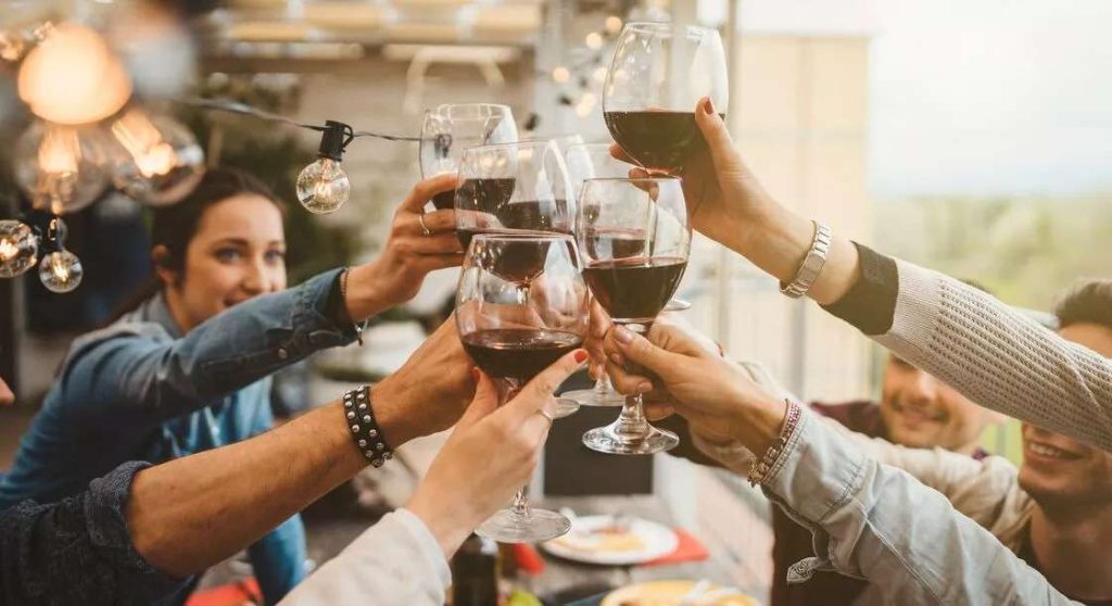customers cheers wine glasses
